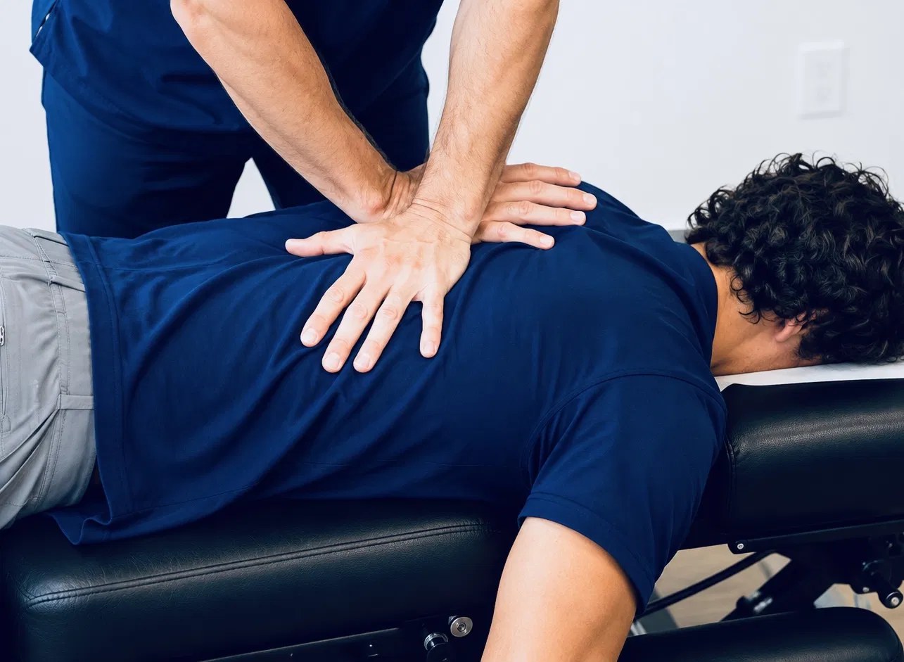 A TRUForm doctor treating a new patient&rsquo;s low back at Texas Functional Health Centers in Dallas, TX