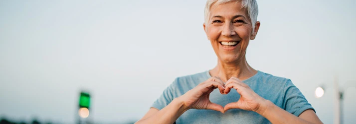 Chiropractic Dallas TX Woman With Heart Hands